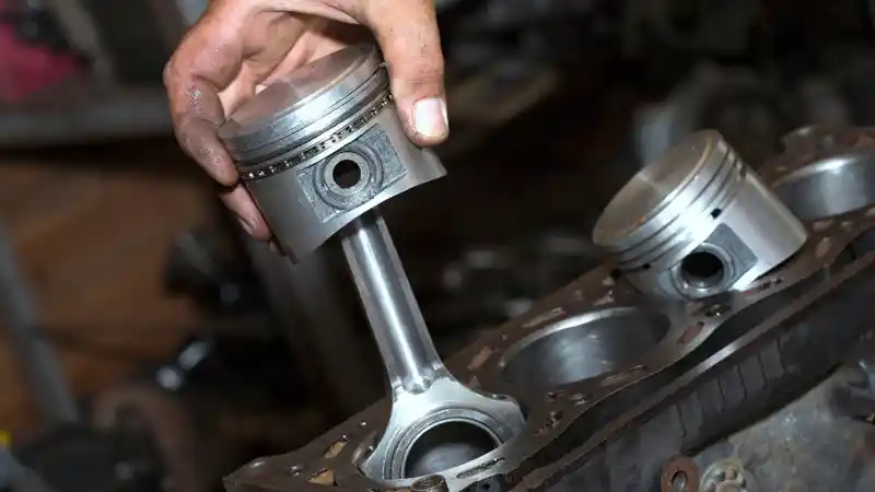 Piston that goes into the cylinder block of an engine